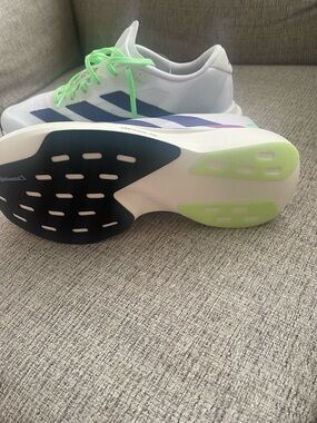 adidas White Sneakers with Blue Stripes and Neon Green Laces